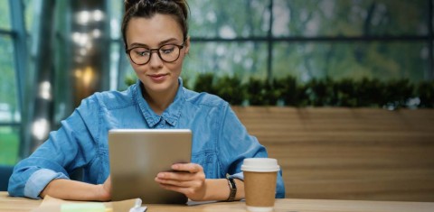 Woman working at desk - creating a Voter Account