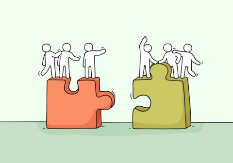 two puzzle pieces that fit with three people on each one separated